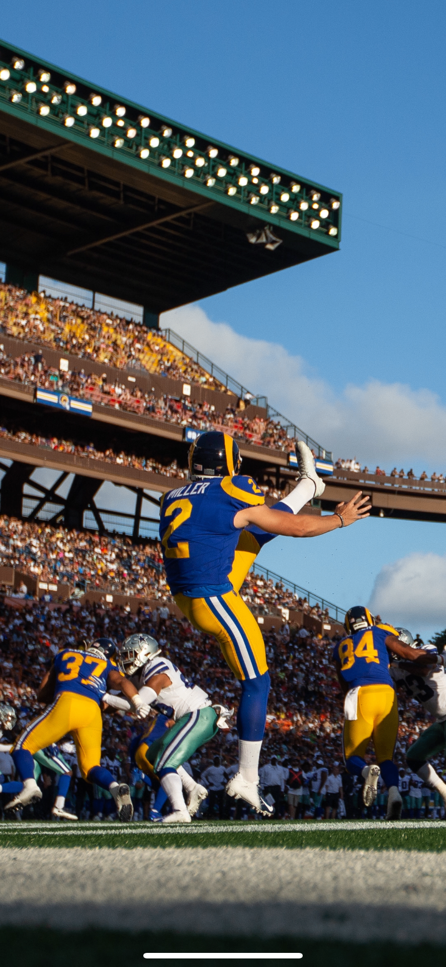 Brock Miller punting for the Los Angeles Rams